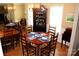 Elegant dining room featuring hardwood floors, a classic china cabinet, and seating for six at 21205 Cold Spring Ln, Cornelius, NC 28031