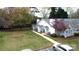 Charming single-story home with well-manicured lawn, welcoming front porch, and cozy seating area at 21205 Cold Spring Ln, Cornelius, NC 28031