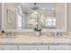 Bathroom with double vanities, stone counters and a glass enclosed shower at 21721 Shoveller Ct, Cornelius, NC 28031