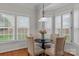 Charming breakfast nook with ample natural light and a cozy table setting at 21721 Shoveller Ct, Cornelius, NC 28031