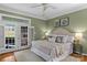 A luxurious main bedroom with ample natural light and decorative pillows at 21721 Shoveller Ct, Cornelius, NC 28031