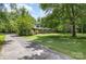 Well-maintained home surrounded by lush greenery, offering privacy and a serene setting at 2681 University Dr, Lancaster, SC 29720