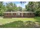 Charming single-story brick home featuring a well-manicured lawn and inviting curb appeal at 2681 University Dr, Lancaster, SC 29720