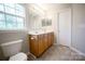 Bathroom featuring double sinks and ample lighting at 2919 Bridgeville Ln, Charlotte, NC 28262