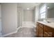 Bathroom featuring tile floors, soaking tub, and stand-up shower at 2919 Bridgeville Ln, Charlotte, NC 28262