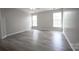 Bedroom featuring hardwood floors and multiple windows at 2919 Bridgeville Ln, Charlotte, NC 28262