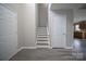 Foyer with staircase and new wood flooring offers a welcoming entrance into the home at 2919 Bridgeville Ln, Charlotte, NC 28262