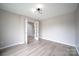 Living room with contemporary lighting and access to other rooms through glass paneled doors at 2919 Bridgeville Ln, Charlotte, NC 28262