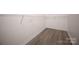 Walk-in closet with hardwood floors and wire shelving at 2919 Bridgeville Ln, Charlotte, NC 28262