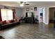 Spacious living room with wood-look floors, comfortable seating, and a large entertainment center at 300 S Oakland Ave, Statesville, NC 28677
