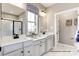Elegant bathroom with double sinks, marble countertops, and a glass-enclosed shower at 3008 Bramble Hedge Dr # 3272, Indian Trail, NC 28079