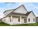 Back exterior of the home featuring a covered patio and expansive yard at 3008 Bramble Hedge Dr # 3272, Indian Trail, NC 28079