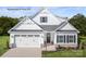 Charming two-story home with a two-car garage, manicured lawn, and classic white facade at 3008 Bramble Hedge Dr # 3272, Indian Trail, NC 28079