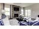 Cozy living room featuring a stone fireplace, hardwood floors, and a sliding door to the outside at 3008 Bramble Hedge Dr # 3272, Indian Trail, NC 28079