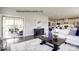 Bright living room featuring hardwood floors, stylish furniture, and a view of the outdoor patio at 3008 Bramble Hedge Dr # 3272, Indian Trail, NC 28079