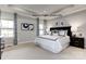 Serene primary bedroom featuring elegant décor, a tray ceiling, and abundant natural light at 3008 Bramble Hedge Dr # 3272, Indian Trail, NC 28079