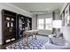 Well-lit office with built-in bookshelves, hardwood floors, and a large window at 3008 Bramble Hedge Dr # 3272, Indian Trail, NC 28079