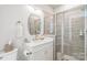 Beautiful bathroom features a modern vanity, stylish mirror, and a glass-enclosed shower with neutral tiling at 3105 Beans Blvd, Charlotte, NC 28203