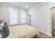 Bright bedroom featuring plantation shutters and hardwood floors at 3105 Beans Blvd, Charlotte, NC 28203