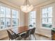 Stylish dining area with modern chandelier and views from bright, sunlit windows at 3105 Beans Blvd, Charlotte, NC 28203