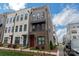 Attractive multi-story townhome featuring modern design and manicured front yard at 3105 Beans Blvd, Charlotte, NC 28203