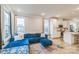 Open-concept living space with a modern kitchen, comfortable seating, and bright windows at 3105 Beans Blvd, Charlotte, NC 28203