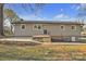 Exterior of home featuring a new deck and updated siding with a grassy backyard at 3205 19Th Ne Ave, Hickory, NC 28601