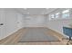 Bright finished basement with a large window, flooring, and a mini split system at 3205 19Th Ne Ave, Hickory, NC 28601