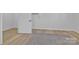 Bright finished basement with flooring, white walls, a door, and a mini split system at 3205 19Th Ne Ave, Hickory, NC 28601