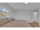 Bedroom featuring a neutral color scheme, large windows, and hardwood floors at 3205 19Th Ne Ave, Hickory, NC 28601