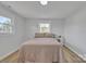 Bright bedroom featuring a neutral palette, large windows, and hardwood floors at 3205 19Th Ne Ave, Hickory, NC 28601