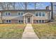 Charming two-story home featuring neutral siding, brick foundation, and a well-manicured lawn at 3205 19Th Ne Ave, Hickory, NC 28601