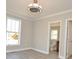 Cozy bedroom featuring modern ceiling fan, neutral walls, and ample natural light at 333 City Ave, Lancaster, SC 29720