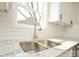 Close-up on modern kitchen details, including stainless steel sink, faucet, and granite countertops at 333 City Ave, Lancaster, SC 29720