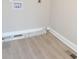 A view of a newly finished laundry room area with vinyl floors and fresh paint at 333 City Ave, Lancaster, SC 29720