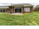 Well-maintained backyard with a small patio and lush lawn at 3721 Oak View Ct, Matthews, NC 28105
