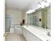 Bright bathroom offers double sinks, a soaking tub, and a separate tiled shower at 3721 Oak View Ct, Matthews, NC 28105
