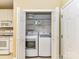 Convenient laundry closet with a washer, dryer, and shelving, located near the kitchen at 3721 Oak View Ct, Matthews, NC 28105