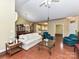 Spacious living room with hardwood floors and view of the dining area and kitchen at 3721 Oak View Ct, Matthews, NC 28105