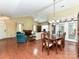 Spacious living room features hardwood floors, vaulted ceilings, and ample natural light at 3721 Oak View Ct, Matthews, NC 28105