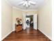 Versatile room featuring hardwood floors, natural light, and an open doorway to another living space at 3721 Oak View Ct, Matthews, NC 28105