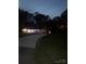 A shot of the home's exterior as night, with a long, curved driveway at 3810 W Franklin Blvd, Gastonia, NC 28052