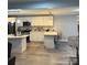 Open kitchen featuring stainless steel appliances, pendant lighting and bar stool seating at the kitchen island at 3810 W Franklin Blvd, Gastonia, NC 28052