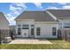 Backyard with white siding featuring a patio, grill, and green lawn at 4039 Holly Villa Cir, Indian Trail, NC 28079
