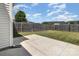Fenced backyard with concrete patio and grassy area, offering a private space for outdoor enjoyment and relaxation at 4039 Holly Villa Cir, Indian Trail, NC 28079