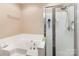 Bright bathroom showcases a white bathtub and glass shower with a modern shower head adding a touch of luxury at 4039 Holly Villa Cir, Indian Trail, NC 28079