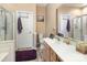 Neutral-toned bathroom featuring a white sink vanity, toilet, and shower with a glass door, creating a calming spa-like feel at 4039 Holly Villa Cir, Indian Trail, NC 28079