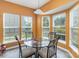 Sun-drenched breakfast nook featuring a glass table and bay windows at 4039 Holly Villa Cir, Indian Trail, NC 28079