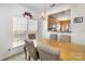 Cozy dining area with a chandelier, window, and view into the kitchen at 4039 Holly Villa Cir, Indian Trail, NC 28079