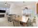 Open-concept living and dining area with fireplace and large windows, great for entertaining at 4039 Holly Villa Cir, Indian Trail, NC 28079